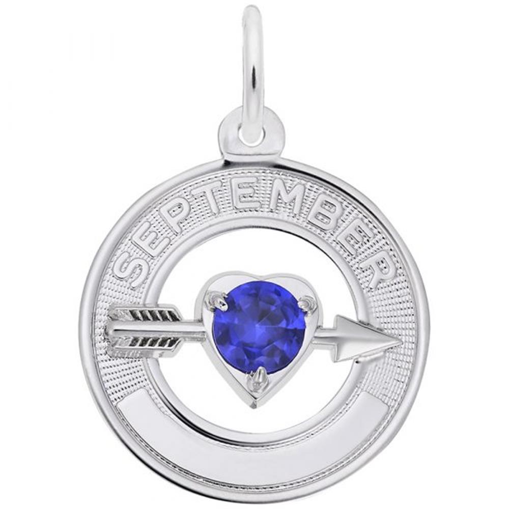 A circular sterling silver charm with "SEPTEMBER" inscribed along the top. Attached to the bottom is an arrow piercing through a heart-shaped blue sapphire, the 09 September birthstone. The 09 September Birthstone Charm in Sterling Silver by Rembrandt Charms features a loop at the top for a chain, perfect for any collection.