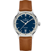 The Hamilton American Classic Intra-Matic Automatic Watch - 40mm showcases a blue dial with white indices, a date window at the 6 o'clock position, and comes with a brown leather strap. This automatic men's watch by Hamilton features a stainless steel case and impeccable movement.