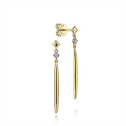 The Gabriel & Co 14K Yellow Gold Diamond and Spike Drop Earrings showcase a slender, tapered design. Each earring is accented with a small diamond-shaped detail set with a tiny gemstone near the top, adding a touch of sparkle. Part of our Contemporary Collection, these earrings feature a post and butterfly back closure.
