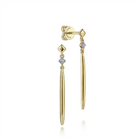 The Gabriel & Co 14K Yellow Gold Diamond and Spike Drop Earrings showcase a slender, tapered design. Each earring is accented with a small diamond-shaped detail set with a tiny gemstone near the top, adding a touch of sparkle. Part of our Contemporary Collection, these earrings feature a post and butterfly back closure.