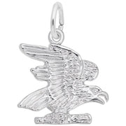 The Rembrandt Charms Eagle Charm is crafted in sterling silver and features a detailed eagle with intricately sculpted feathers, wings spread wide, and perched on a small branch. This elegant jewelry piece includes a loop at the top for easy attachment to a bracelet or necklace.