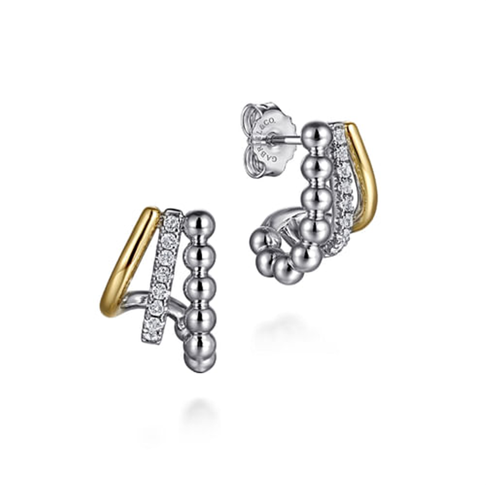 Sophisticated hoop earrings from Gabriel & Co feature 925 sterling silver and 14k yellow gold with silver spheres, white sapphires, and a gold-curved edge for a modern design.