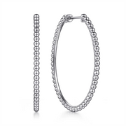 A pair of 925 Sterling Silver Bujukan Oval Classic Hoop Earrings from the Gabriel & Co Bujukan Collection is displayed against a white background. Made from high-quality 925 sterling silver, these earrings feature small, round beads arranged in a continuous loop, giving them a textured appearance. One earring is shown from the side, while the other is front-facing.