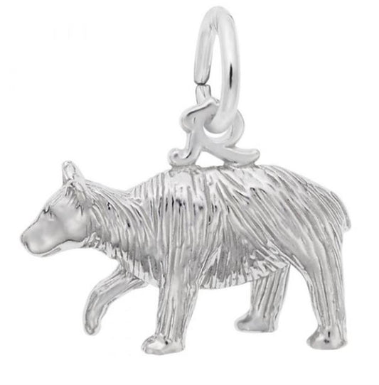 The Rembrandt Charms Black Bear Charm, crafted in sterling silver, features a textured surface and a loop at the top for easy attachment to bracelets or necklaces. The bear, depicted in a walking pose, showcases intricate details in its fur and body shape, making it an embodiment of empowerment.