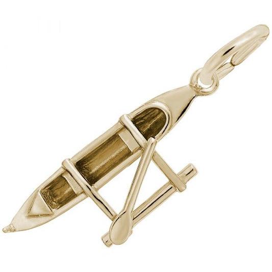 The Rembrandt Charms Outrigger Canoe Charm is a 10K yellow gold charm intricately designed to resemble an outrigger canoe. It features a detailed kayak with a paddle attached, complete with a small oval opening for where a person would sit and elaborate lines that highlight its elegant design.