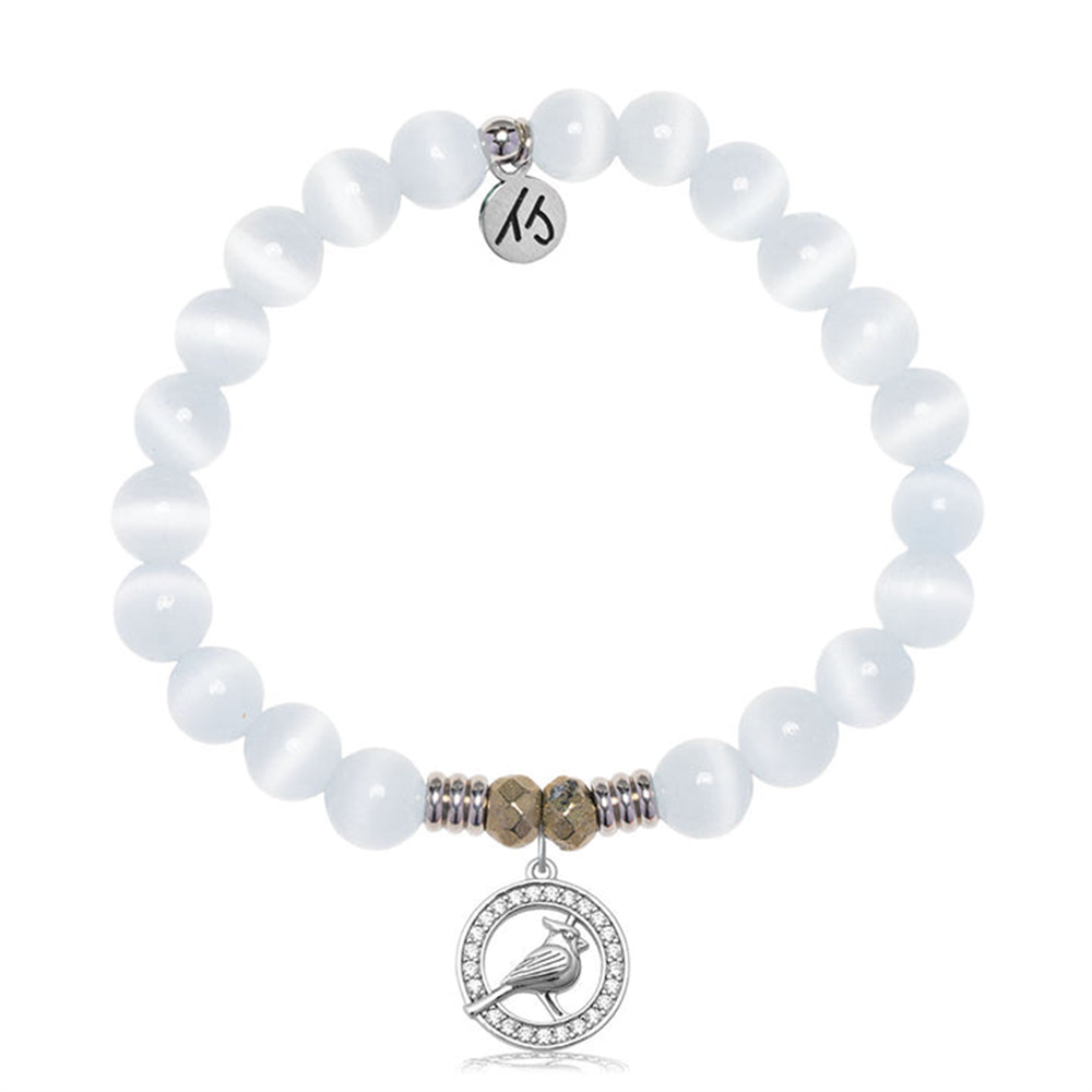 The T Jazelle White Cats Eye Gemstone Bracelet features smooth white beads, metallic accents, a sterling silver cardinal charm, and a “13” engraved tag—creating a unique accessory.