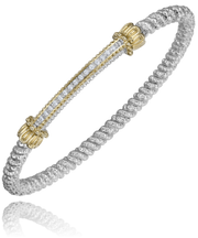 The intricately designed Alwand Vahan Jewelry sterling silver bracelet features twisted metalwork and decorative 14k gold accents at the clasp points, adorned with a central row of sparkling diamonds weighing 0.11 carats. The bracelet’s sleek, reflective surface adds elegance to its luxurious appearance. The band is 3mm wide, complementing the overall sophisticated design.