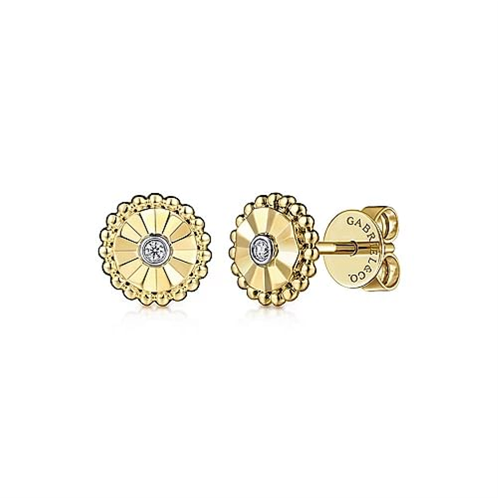A pair of 14K White and Yellow Gold Diamond Stud Earrings with circular designs. Each earring features a central diamond surrounded by a decorative, textured pattern that resembles petals or sun rays. The backing is engraved with the brand name "Gabriel & Co.