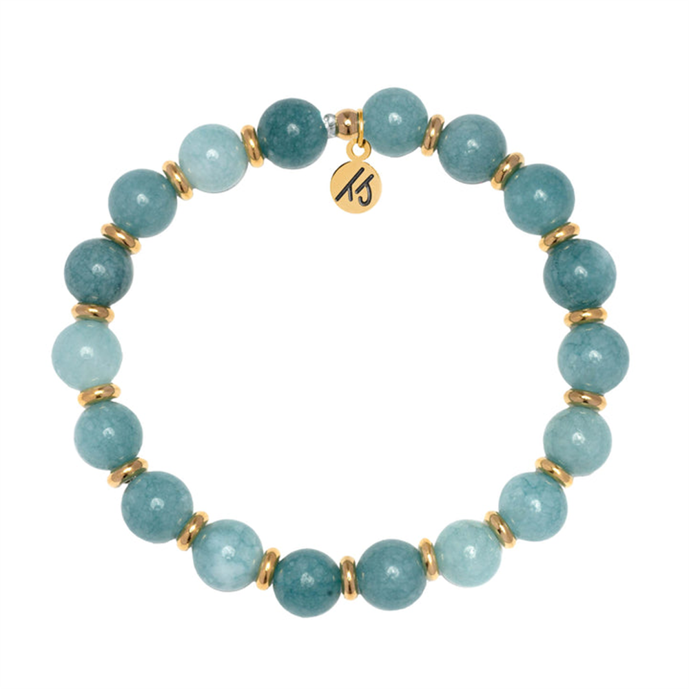 Part of the T Jazelle Gold Empowered Elegance Collection, the Mountain Blue Jade Gemstone Bracelet features round blue-green stones, gold spacers, and an engraved gold charm arranged in a circle on a white background.