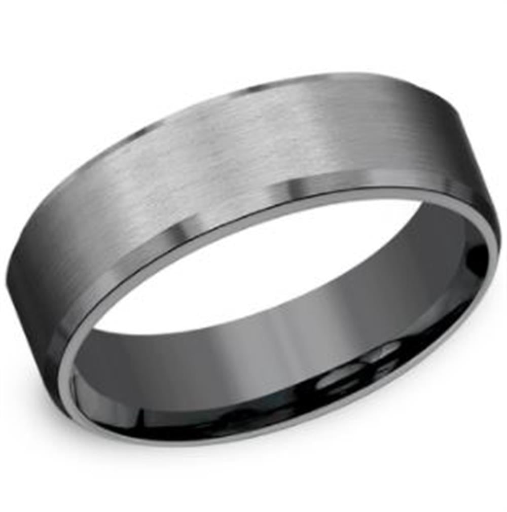 A close-up image of the Benchmark Rings 7mm Tantalum Slight Beveled Edge and Satin Finish ring. This sleek, brushed metal ring showcases a smooth satin finish with a subtle sheen, complemented by its polished interior and edges that provide a glossy finish. Exuding a modern and minimalist aesthetic, this tantalum ring offers a comfort-fit design.