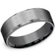 A close-up image of the Benchmark Rings 7mm Tantalum Slight Beveled Edge and Satin Finish ring. This sleek, brushed metal ring showcases a smooth satin finish with a subtle sheen, complemented by its polished interior and edges that provide a glossy finish. Exuding a modern and minimalist aesthetic, this tantalum ring offers a comfort-fit design.