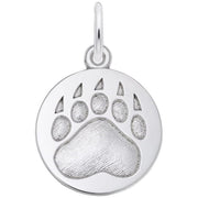 A silver circular pendant from Rembrandt Charms, featuring an engraved bear paw print design, is shown. The Bear Paw Print Charm in Sterling Silver has a glossy finish with textured details on the paw print and a small loop at the top for attaching to a chain or bracelet. It’s perfect for those who cherish wilderness jewelry.