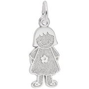 The Girl With Dress & Flower Charm in Sterling Silver by Rembrandt Charms features a little girl with a short bob haircut and a happy facial expression. She wears a textured dress adorned with a flower design, and the charm includes a small loop at the top for easy attachment to a necklace or bracelet.