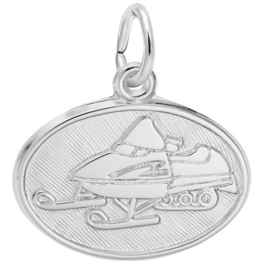 The Rembrandt Charms Snowmobile Charm in sterling silver boasts an oval shape with a detailed engraving of a snowmobile. The charm showcases a smooth, polished surface against a textured background, accentuating the snowmobile design. It features a small metal loop at the top for easy attachment to a chain or bracelet.