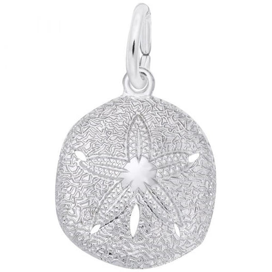 The Sand Dollar Charm in Sterling Silver by Rembrandt Charms showcases intricate details, with a central star-shaped pattern and small cutouts. It features a convenient loop at the top, making it easy to attach to a necklace or bracelet.
