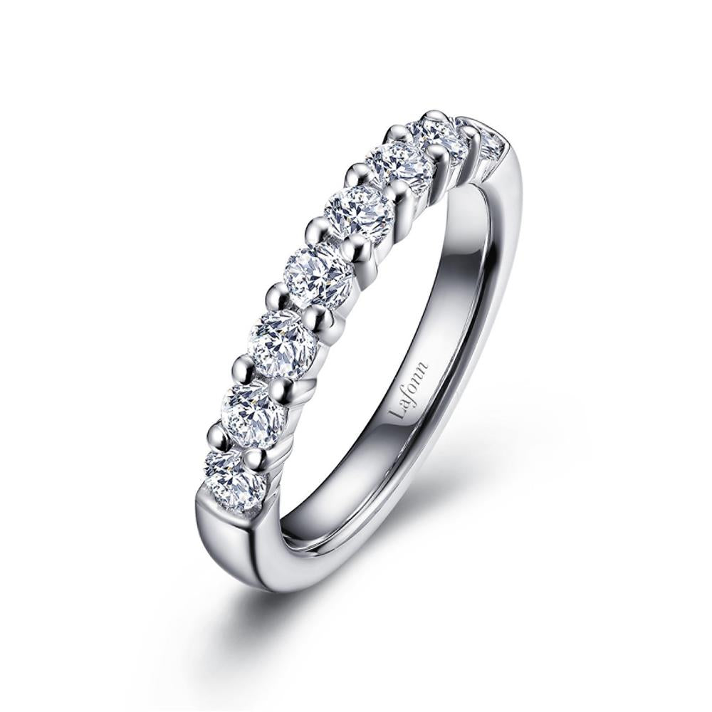 A sleek sterling silver ring adorned with a row of round-cut diamonds, set in a simple and elegant half-eternity band design by Lafonn. The inner band is engraved with the word "Leform.