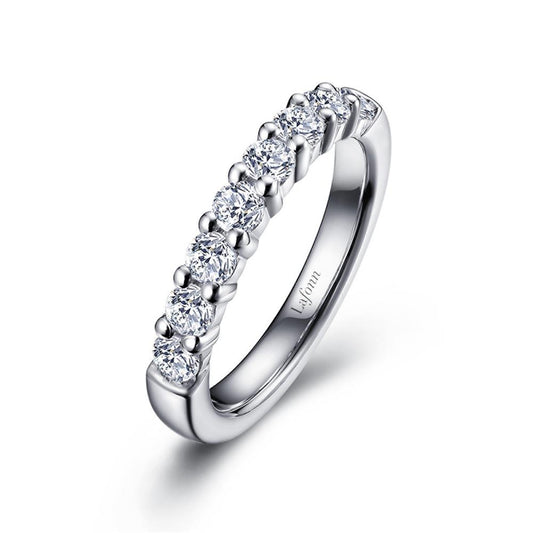 A sleek sterling silver ring adorned with a row of round-cut diamonds, set in a simple and elegant half-eternity band design by Lafonn. The inner band is engraved with the word "Leform.