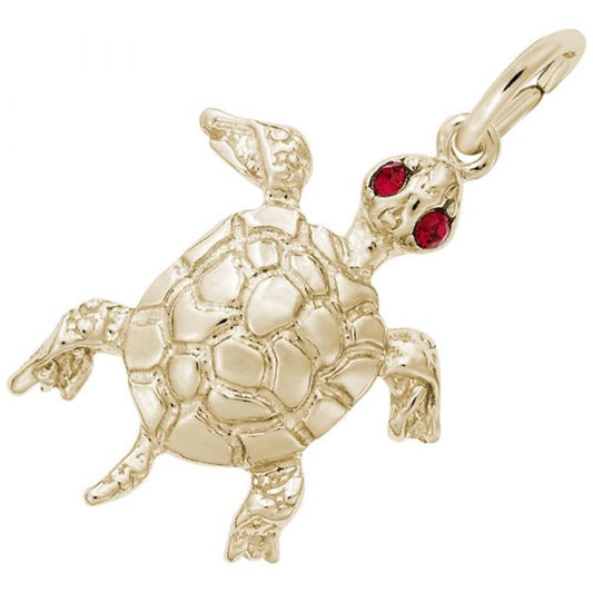 The Turtle With Stones Charm from Rembrandt Charms is a gold-plated sterling silver piece featuring a detailed shell and flippers, two small red gemstone eyes, and an attachment ring at the top.
