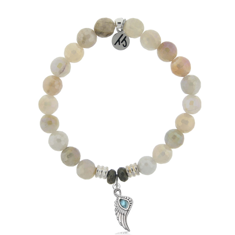 The T Jazelle Larimar Charm Collection bracelet features round moonstone and Larimar gemstone beads, silver accents, a sterling silver initial charm, and a central silver wing pendant with turquoise detail.