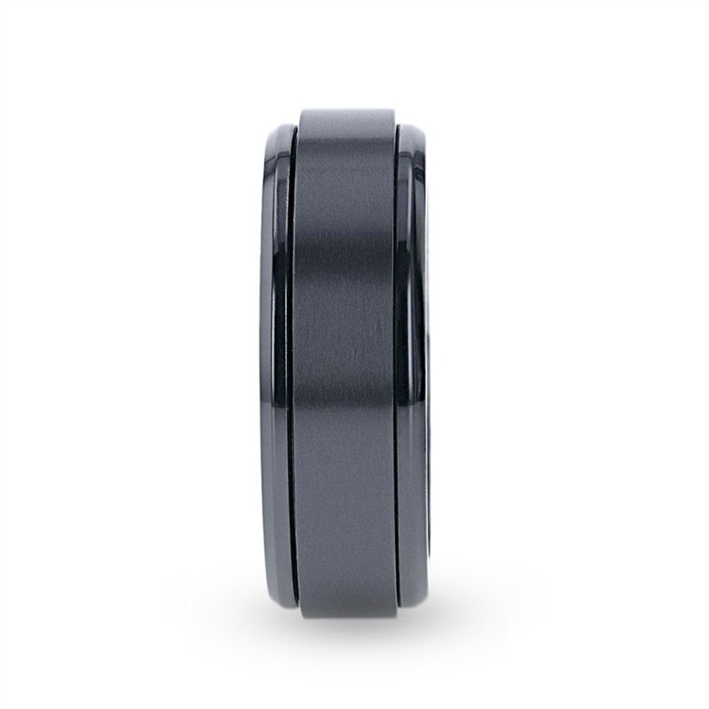 A sleek and modern Thorsten PHANTOM Black Titanium Spinner Ring, 8mm, displayed vertically against a white background. The ring features a smooth, metallic black design with a brushed finish and slightly glossy edges.