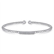 The 14K White Gold Bujukan Bead Bangle with Diamonds by Gabriel & Co is a delicate silver bracelet featuring small, round beads strung together with a central rectangular bar encrusted with sparkling crystals. Its adjustable ball ends ensure a comfortable fit, making this piece both elegant and versatile.