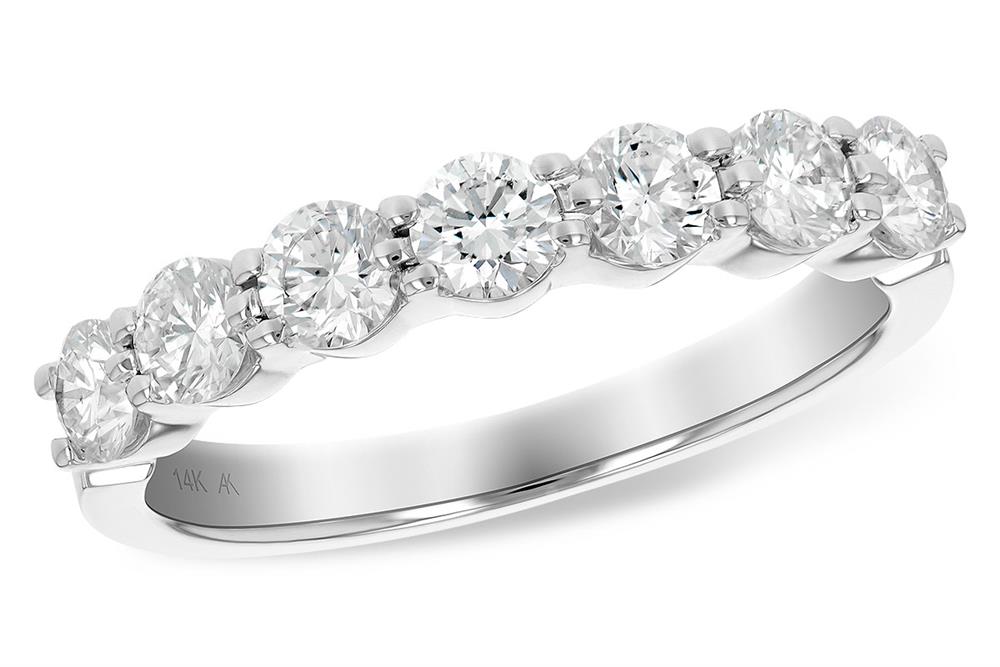 The Allison Kaufman Ladies Diamond Wedding Ring | 1 carats features a row of sparkling round-cut diamonds set in a shared prong setting on a white gold band. The inner band is engraved with "14K AK." This ring masterfully combines elegance and brilliance, showcasing the eternal beauty of diamonds prominently.