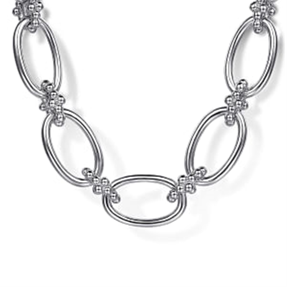 The Gabriel & Co 925 Sterling Silver Oval Link Chain Necklace features a series of interlocking oval links, each adorned with small bead-like Bujukan connectors at the connection points, forming a decorative pattern along the length of the necklace. The background is plain and white.