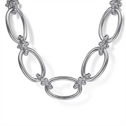 The Gabriel & Co 925 Sterling Silver Oval Link Chain Necklace features a series of interlocking oval links, each adorned with small bead-like Bujukan connectors at the connection points, forming a decorative pattern along the length of the necklace. The background is plain and white.