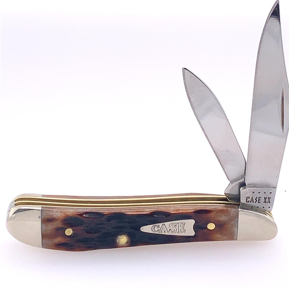 A partially unfolded Brown Bone Peach Seed Jig Knife from W.R. Case & Sons Cutlery Co., with two stainless steel blades and a textured brown bone handle featuring an embedded metal plate engraved with "Case." The base of the blades is also engraved with "CASE XX" against a plain white background.