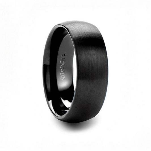 The RAIDER Black Tungsten wedding band from Thorsten, featuring a brushed finish and engraved with the brand name and logo on the inside. This 6mm ring boasts a sleek, smooth exterior and a wide band design.