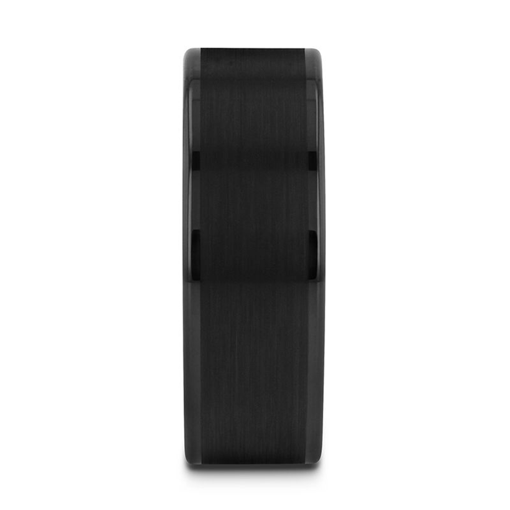 The Thorsten VULCAN Flat Black Tungsten Ring features a brushed center and polished edges. With its flat surface and squared edges, this band exudes a modern, sleek appearance. The vertical image view highlights its smooth texture and minimalist design.