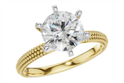 Allison Kaufman 14k yg textured engagement ring with a round brilliant-cut center stone held by six silver-toned prongs and a beaded surface band.