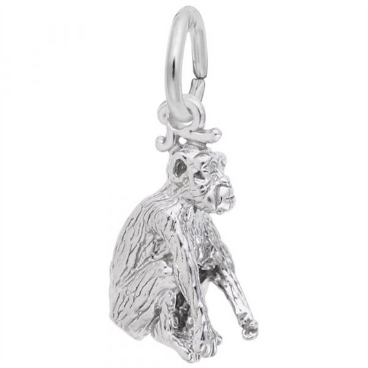 The Rembrandt Charms Chimpanzee Charm is crafted in sterling silver, featuring a seated monkey with textured fur and facial details, and includes a circular loop for attaching to bracelets or necklaces.