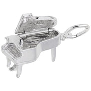 The image shows the Sterling Silver Baby Grand Piano Charm from Rembrandt Charms. This charm is crafted in sterling silver and features an intricately detailed design of a baby grand piano. The charm measures 0.42 inches by 0.67 inches (10.53 mm x 16.86 mm), and the style number is 8252. This elegant charm is perfect for music lovers and pianists, making a beautiful addition to any charm bracelet.