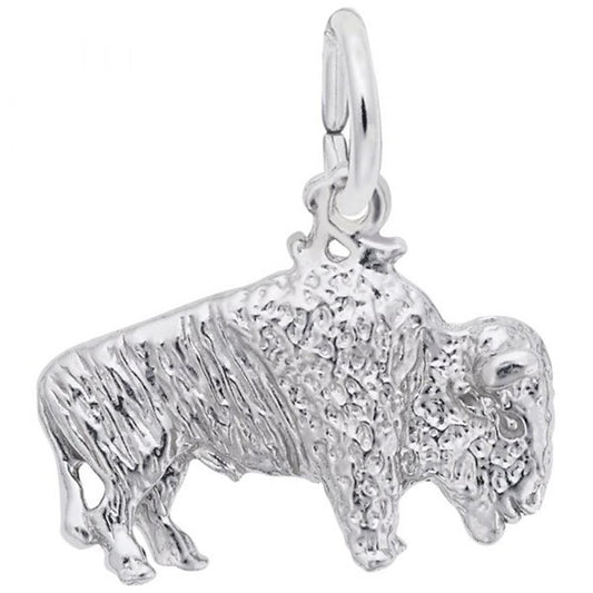 A close-up image of the Bison Charm in Sterling Silver by Rembrandt Charms, showcasing its textured and detailed design. Hanging from a small circular loop at its back, the charm captures the bison's characteristic hump and shaggy fur with remarkable precision.
