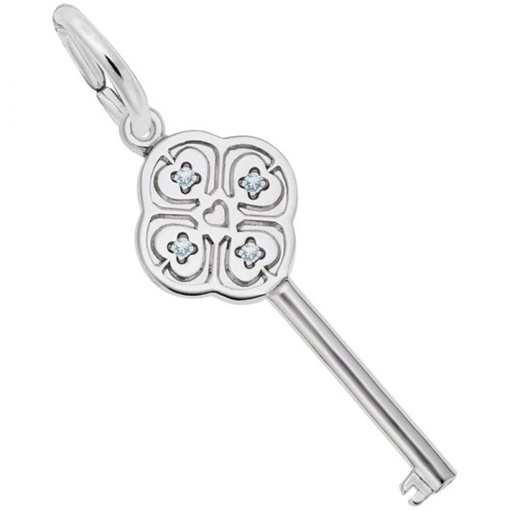 Introducing the "Key to My Heart March Stone Charm" by Rembrandt Charms: This sterling silver key pendant showcases a clover-like design with four-leaf motifs, each accented with a small March birthstone at the center. A heart shape embellishes the middle, and the key features a polished finish. It is attached to a round loop, perfect for wearing on a chain.