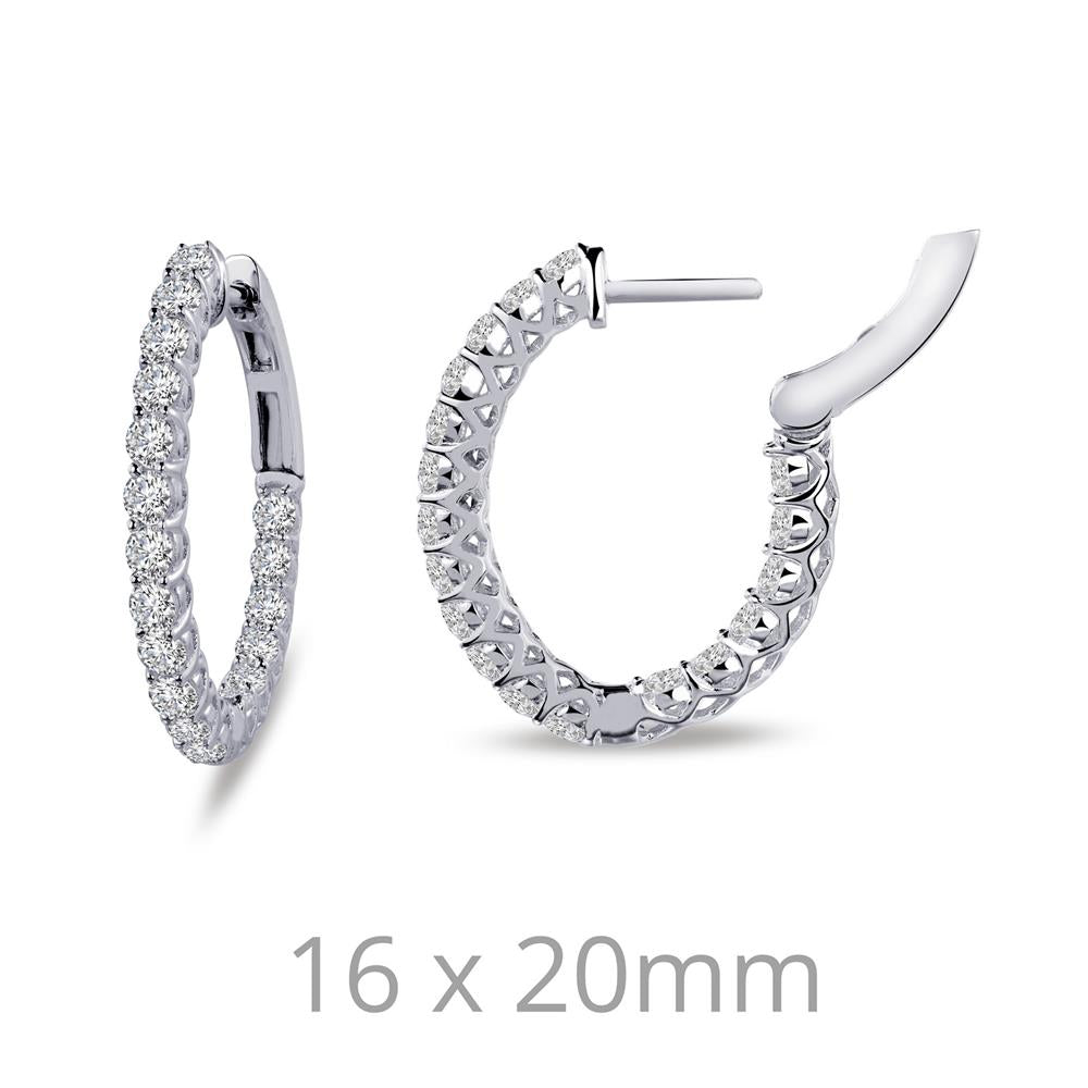 Close-up of the Lafonn Diamond Oval Hoop Earrings, a pair of sterling silver hoops encrusted with small, sparkling simulated diamonds. The earrings are shown from two angles: one from the side, displaying the outer design, and one showing the inner detailing and clasp mechanism. Dimensions "16 x 20mm" are noted below.