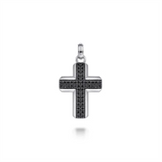 The Gabriel & Co Sterling Silver and Black Spinel Cross Pendant showcases a 925 sterling silver construction adorned with small black spinels. It features a textured design in the center and includes a small loop at the top for attaching to a chain. The plain white background highlights the pendant's intricate details.