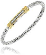 An exquisite bracelet from Alwand Vahan Jewelry, featuring a sterling silver band with a diameter of 3mm, highlighted by a cylindrical centerpiece adorned with 0.07 carats of small diamonds and flanked by elegant 14k gold accents on each end. The piece showcases a textured, beaded design and is beautifully displayed against a white background.