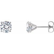 Simply Diamonds' 14KW 1/2 CTTW Lab Grown Diamond Studs feature round-cut lab grown diamonds set in prong settings. The earrings boast a simple, elegant design with prominently displayed diamonds. One earring is shown from the front, while the other is shown from the side to highlight the setting and post.
