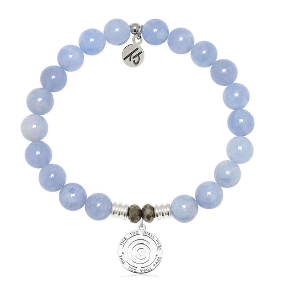 The T Jazelle Sky Blue Jade Gemstone Bracelet features small silver and dark beads, a sterling silver "THIS TOO SHALL PASS" charm, and a round "TB" charm.