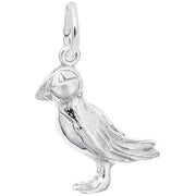 A detailed image of the Sterling Silver Puffin Charm by Rembrandt Charms. This charm features an intricately detailed puffin, measuring 0.24 inches by 0.68 inches (6.2 mm by 17.33 mm). The charm has a polished sterling silver finish, perfect for adding a touch of whimsical wildlife to any charm bracelet or necklace. Style number 3384.