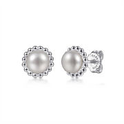 Introducing the 925 Sterling Silver Bujukan Pearl Stud Earrings from Gabriel & Co's *Bujukan Collection*. These elegant earrings feature centrally placed pearls, adorned with a detailed silver beaded border. Crafted from 925 sterling silver, they are held securely by backs inscribed with the manufacturer's name. This classic and sophisticated design is perfect for various occasions.