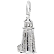 The Peggy's Cove Lighthouse Charm in Sterling Silver by Rembrandt Charms features intricate detailing, including engraved "Peggy's Cove" on its side. The charm showcases detailed windows, a small attached building at the base, and a loop at the top for easy attachment to a chain or bracelet.