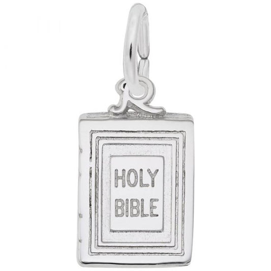 A stunning Bible Charm crafted from sterling silver by Rembrandt Charms, featuring a book design with "HOLY BIBLE" engraved on the front cover. This pendant boasts a small attached loop at the top, making it perfect for use as either a charm or necklace. Its simple, elegant design with a polished finish beautifully captures Bible symbolism.