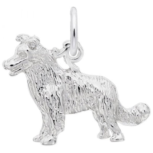 The Border Collie 3D Dog Charm in Sterling Silver by Rembrandt Charms captures the essence of a Border Collie with its detailed fur texture, perky ears, raised tail, and a small hoop at the top for easy attachment to jewelry. This sterling silver charm showcases the dog in a standing position.