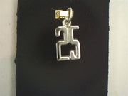 The Rembrandt Charms Number 25 Charm in sterling silver is showcased against a dark background. The pendant boasts a simple, geometric design and is attached to a small, gold-colored clasp.