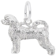 The Rembrandt Charms Portuguese Water Dog Charm in Sterling Silver is intricately designed to capture the curly fur of the breed. Featuring detailed texturing that mimics the dog's coat, this charm includes a curled tail and a sturdy loop at the top for easy attachment to a bracelet or necklace. The dog stands in profile, looking left.