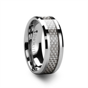 The ULTIMUS Tungsten Carbide Ring by Thorsten features a sleek, polished finish and a reflective surface. A woven white carbon fiber inlay encircles the center of its 6mm width, creating a modern and stylish appearance. The inner band is engraved with the word "Thorsten," epitomizing top-tier craftsmanship for size 10 wearers.