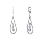 Introducing the Fancy Hoop Drop Earrings by Lafonn: These elegant teardrop-shaped earrings are expertly crafted in sterling silver and adorned with small diamonds along the edges. Each earring features three graduated round-cut diamonds suspended in the center, delivering a delicate and luxurious look.